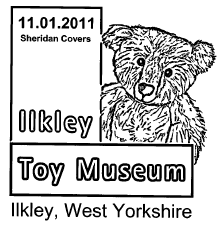 Postmark showing teddy bear logo of Ilkley toy museum.