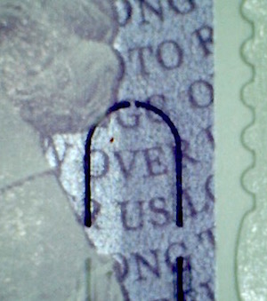 Detail from Machin definitive stamp in mixed content book. 